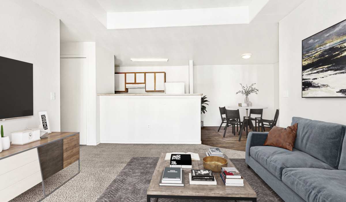 Well-lit living room at Tierra Antigua Apartments in Mesa, Arizona