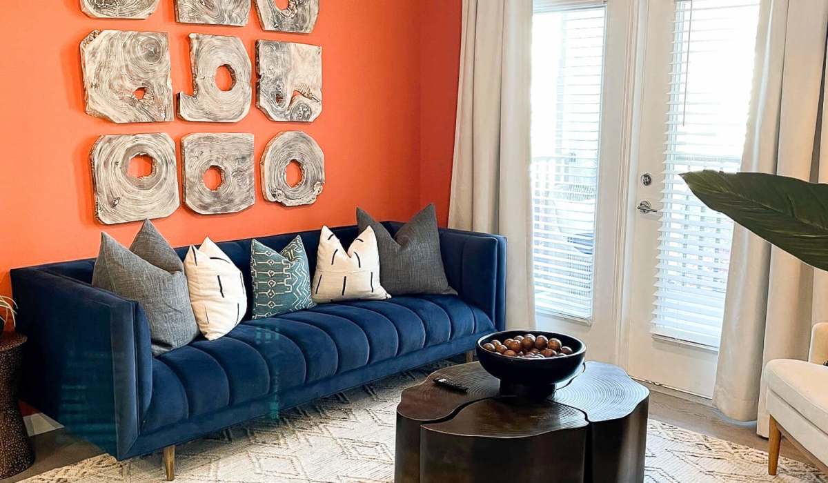 Well-lit living room with a comfortable couch at Palisades at Surf City in Hampstead, North Carolina