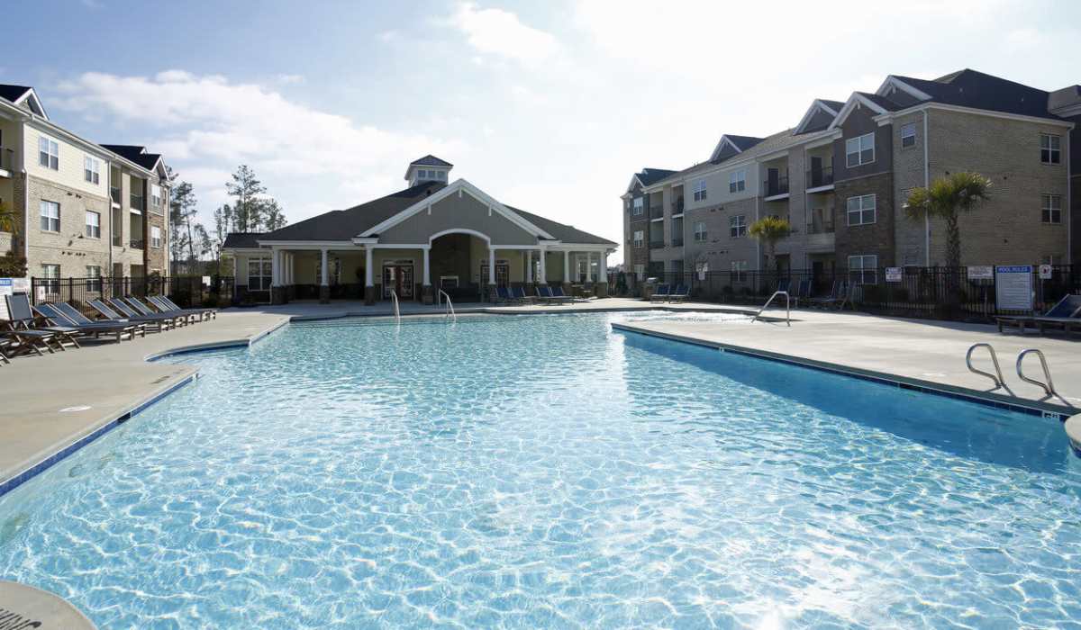 Swimming pool with sun deck at Palisades of Jacksonville in Jacksonville,North Carolina