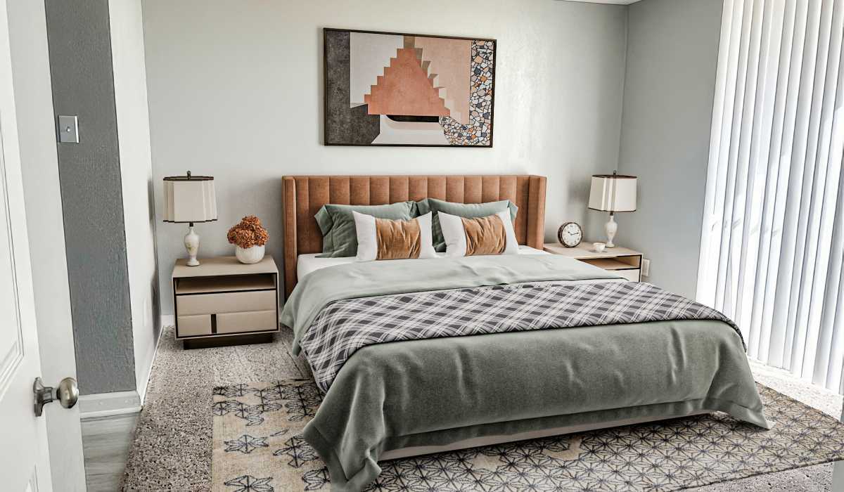  A simple bedroom layout with a bed, a chair, and a window, creating a bright and inviting atmosphere at Cliffside at Mountain Park in El Paso, Texas