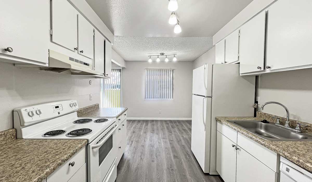 Kitchen with wooden cabinets at Village of the Pines in Reno, Nevada