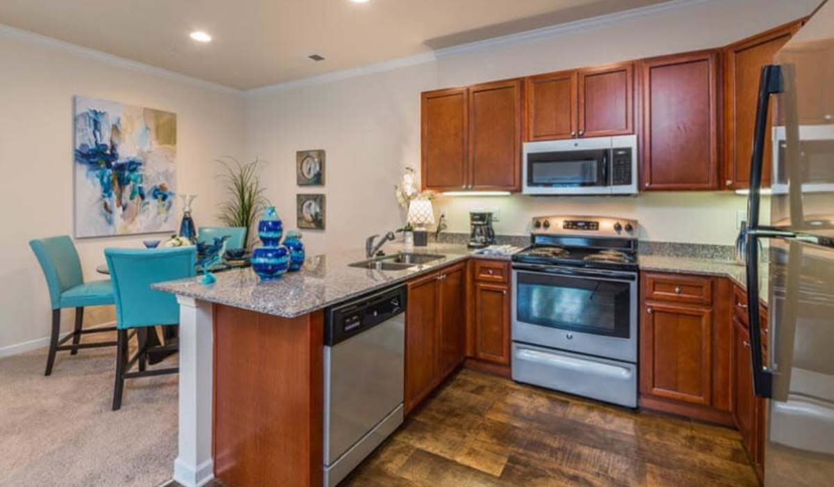 Dining room attached to modern kitchen at Palisades at New River in Hardeeville, South Carolina