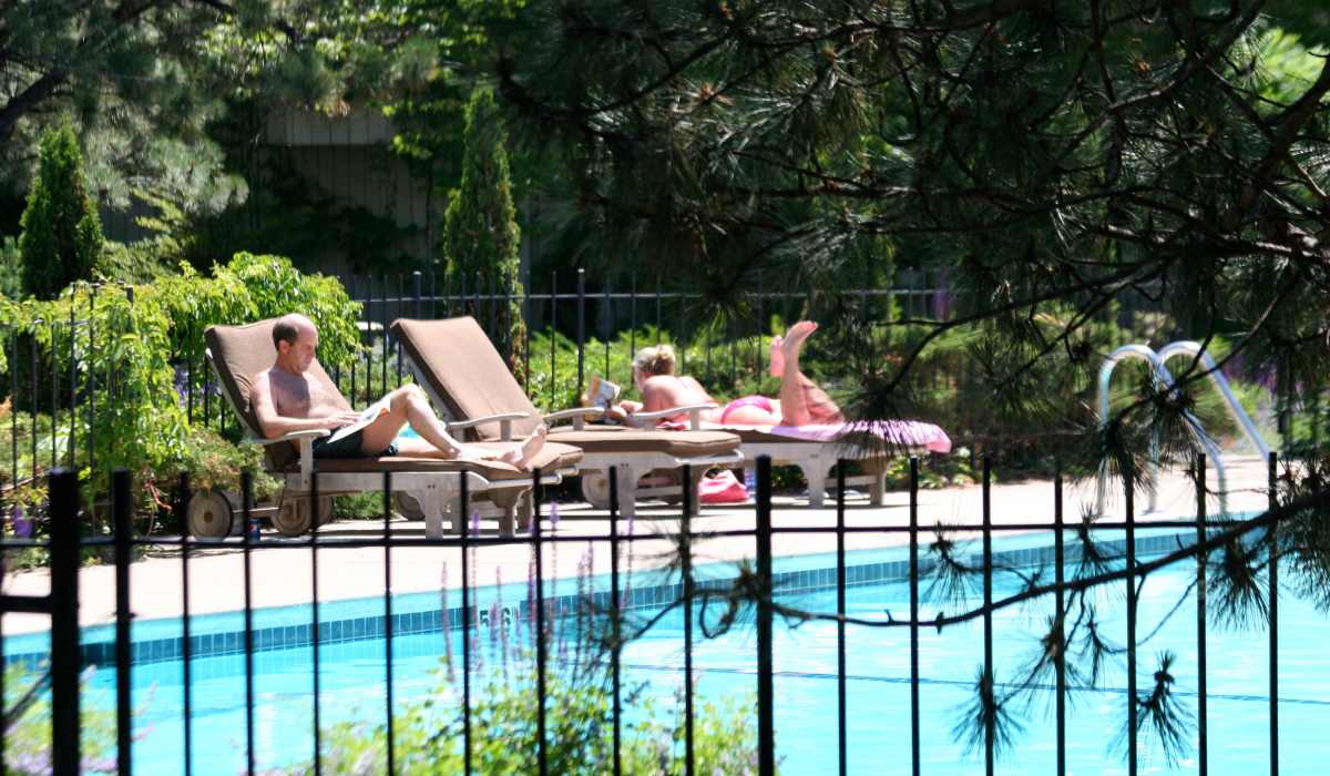 Relax at the outdoor pool at Cedars of Edina in Edina, Minnesota