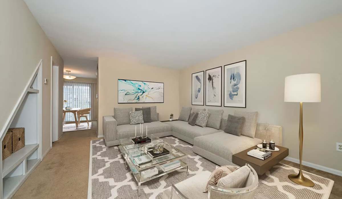 Living room with modern furnishings at Williamsburg of Cincinnati in Cincinnati, Ohio