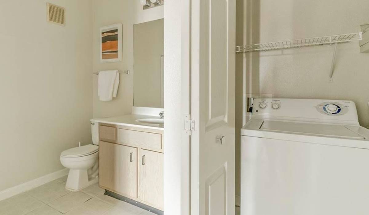 Bathroom with laundry area at Settlers Ranch Apartments in Houston,Texas