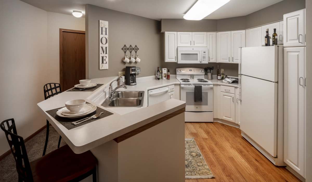 Kitchen with white appliances at Deer Creek in Middleton, Wisconsin