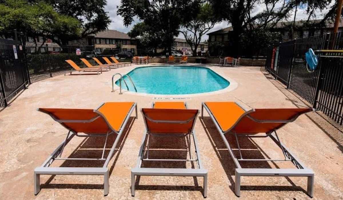 Relax in the refrsehing swimming pool at Costa Mesa Apartments in Houston, Texas