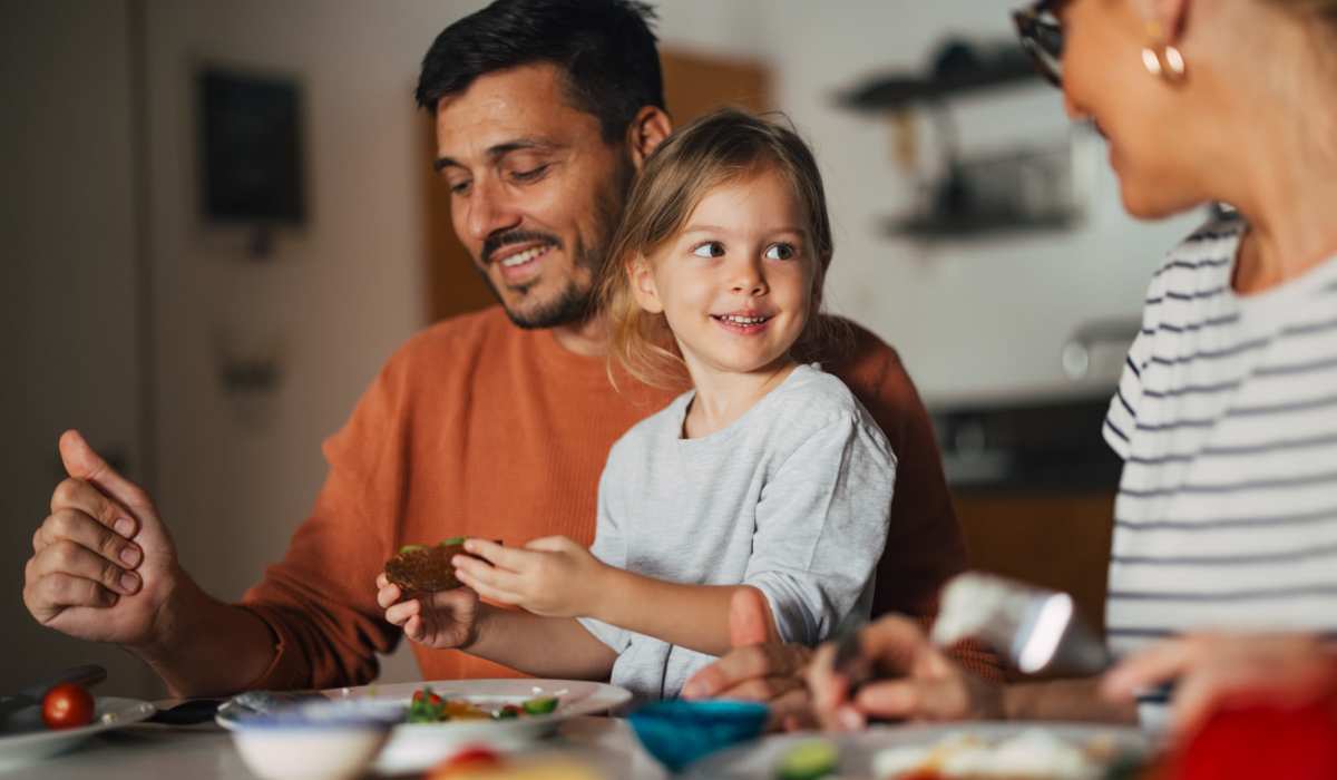 Family dining in their apartment at Cottages at Craft Farms in Gulf Shores,Alabama