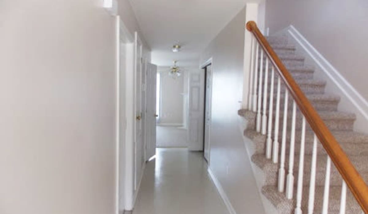 Staircase with hallway at Tangi Lakes in Hammond, Louisiana