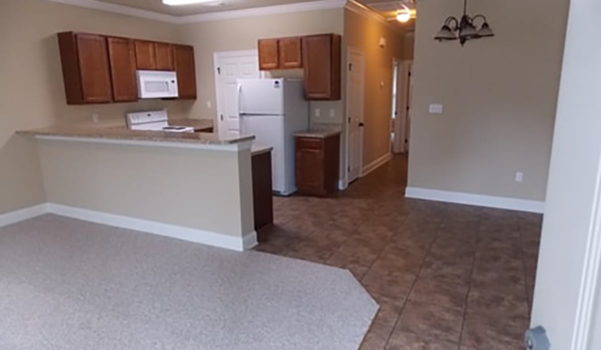 Kitchen with wooden flooring at Tangi Lakes in Hammond, Louisiana