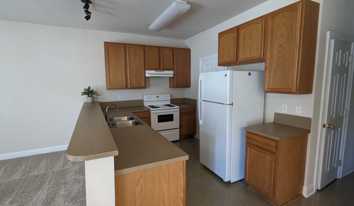 Kitchen with white color appliance at Tangi Lakes in Hammond, Louisiana