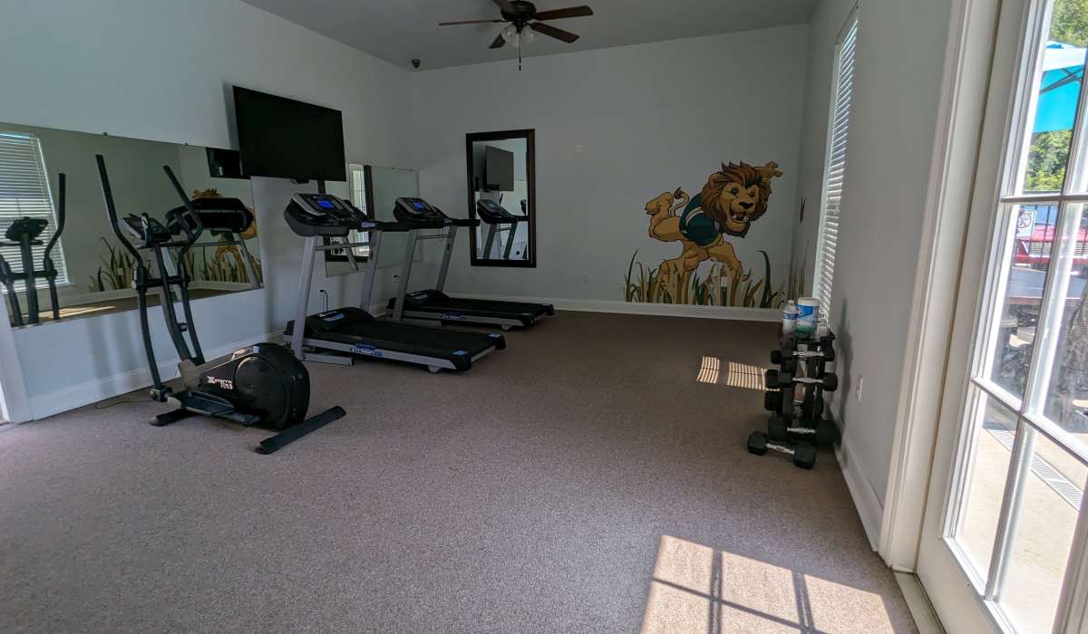 Fitness center with carpet flooring at Tangi Lakes in Hammond, Louisiana