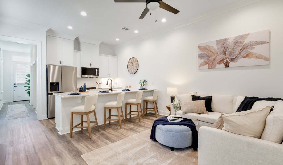 Dining space with view of kitchen and living at Trinity Villas in Lafayette, Louisiana