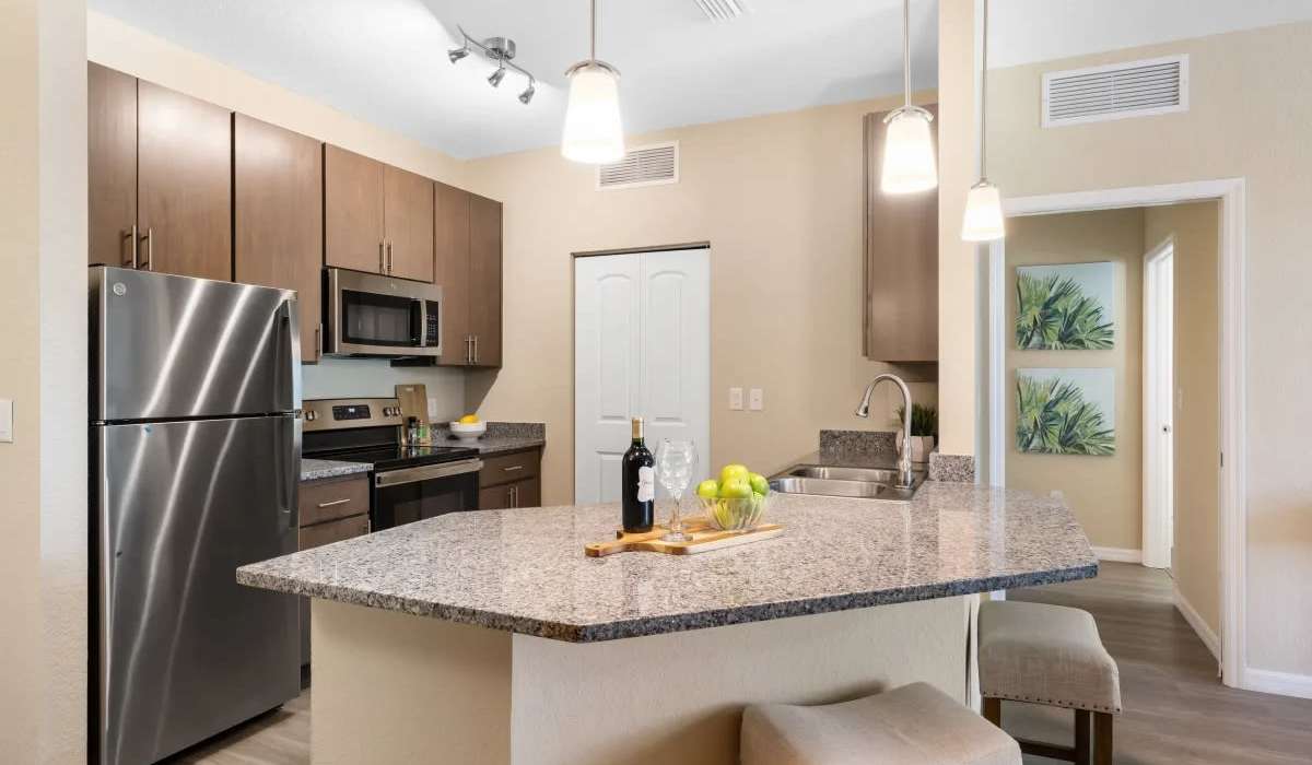 Kitchwn with breafast island  at The Residences at Creighton Waterway in North Port, Florida