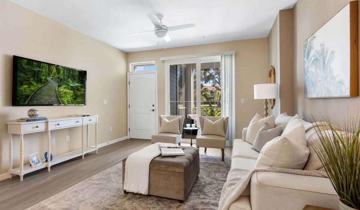 Living room with attached patio  at The Residences at Creighton Waterway in North Port, Florida