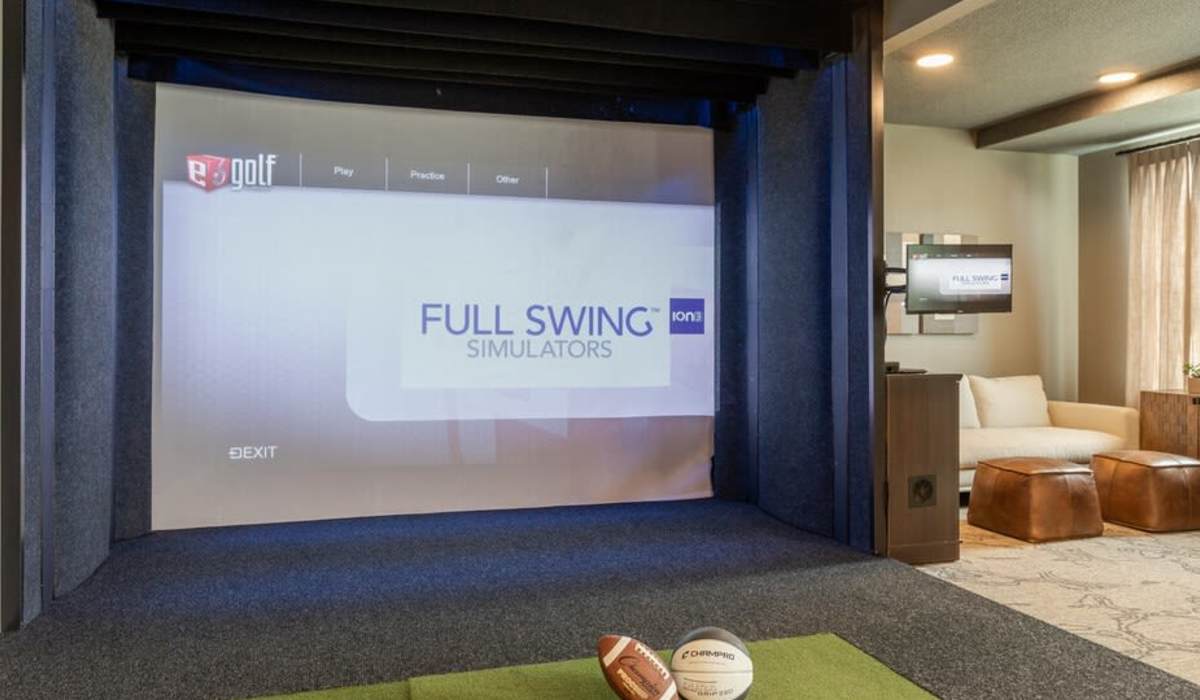 Entertainment room with golf simulator at Palisades at Lewis Creek in Wilmington, North Carolina