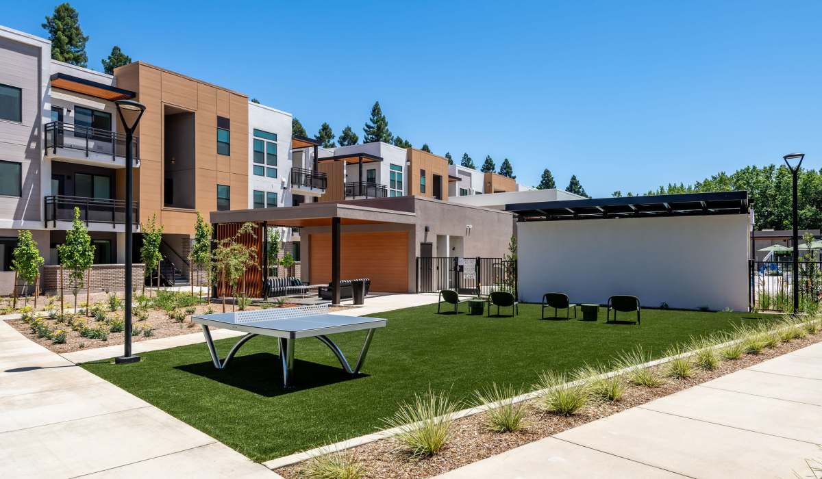 Outdoor games and movie area at Phase 2 of Sutter Green Apartments in Sacramento, CA