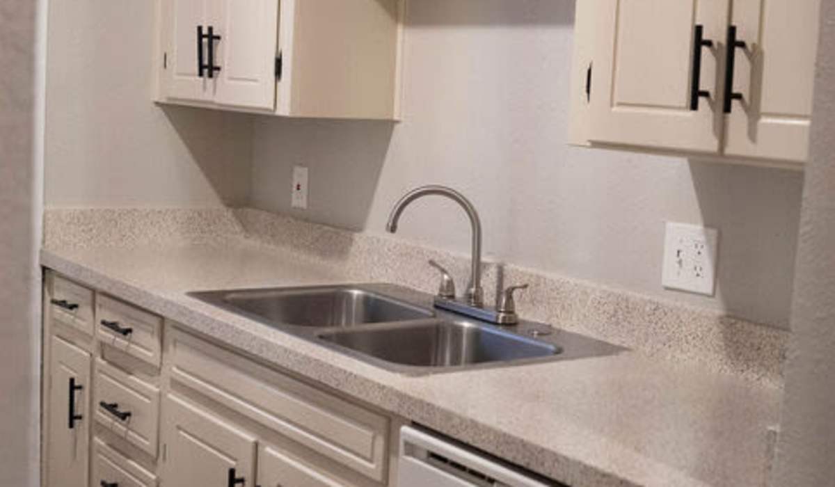 Kitchen with granite countertop  at Hurst Gardens in Hurst, Texas