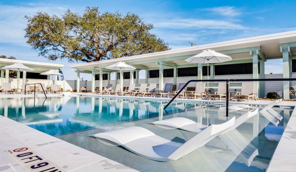 Swimming pool with sunlounger at Trinity Villas in Lafayette, Louisiana