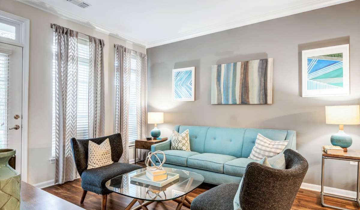 Living room with beautiful wall art at Jefferson Arbors at Broadlands in Ashburn, Virginia 