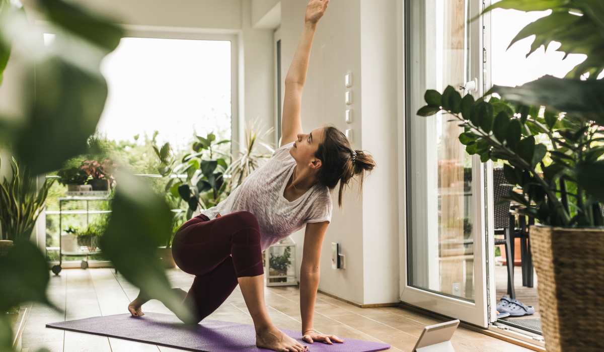 Female Resident Doing Yoga at Arden at South Point Apartment Homes in McDonough, Georgia