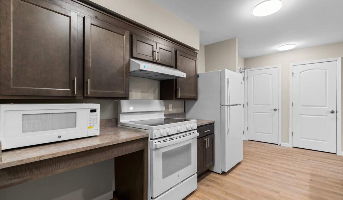Kitchen space with light appliances Millersview Crossing in Millersville, Maryland