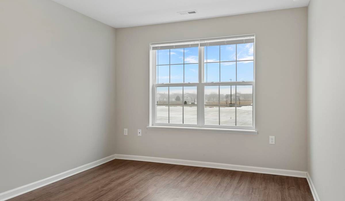 Well-lit bedroom at Parker Glen in Champaign, Illinois