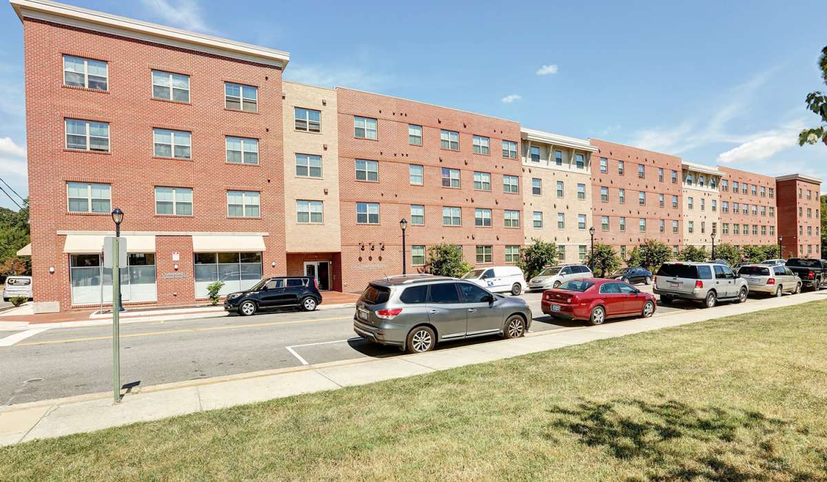 Apartments exterior view with off street parking at Freedman Point in Hopewell, Virginia