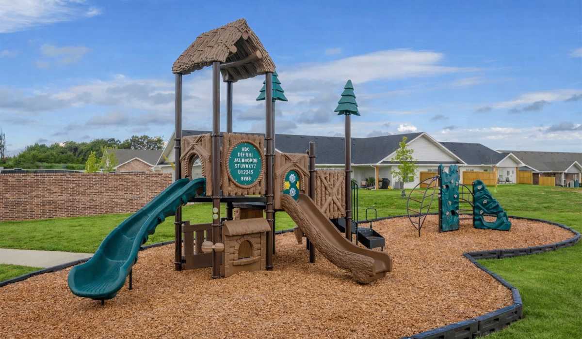 Swimming pool with lounge beds at Sycamore Heights Townhomes in Tontitown, Arkansas