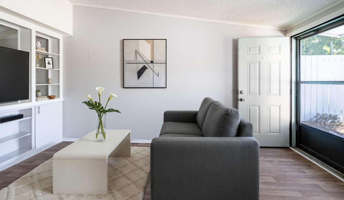 Living room with wood-style flooring at Canyon and Knox Landing Apartments in Knoxville, Tennessee