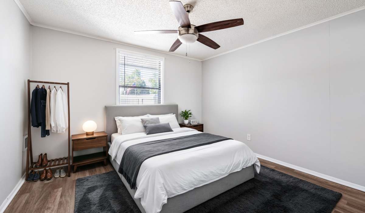 Bedroom with a ceiling fan at Canyon and Knox Landing Apartments in Knoxville, Tennessee