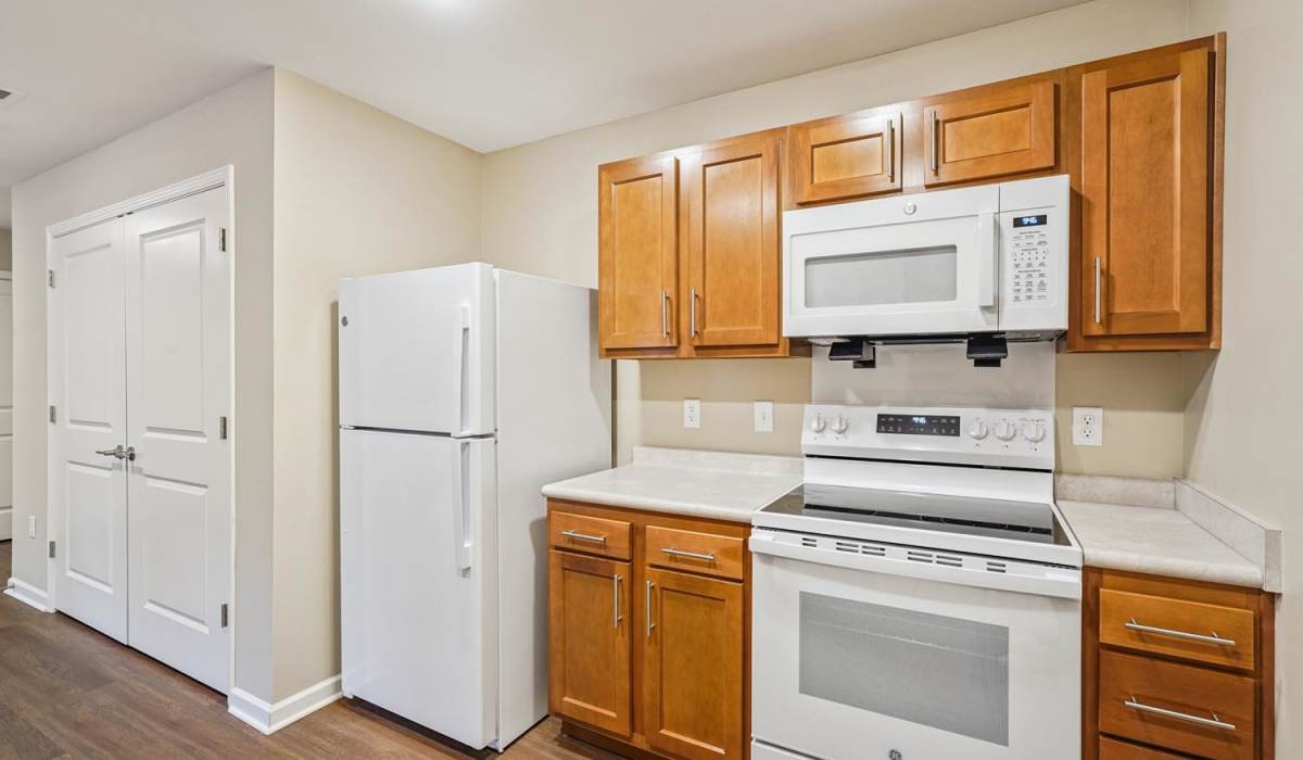 Modern kitchen with granite countertops and stainless steel appliances at Alley Landing in Des Moines, Iowa
