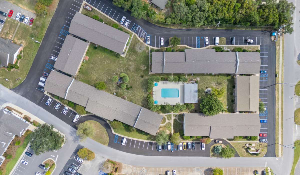 Aerial view of apartment community with pool at Breeze Apartments in Gulf Breeze, Florida