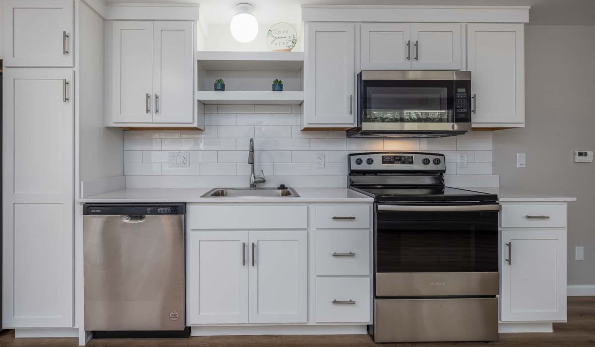 Kitchen with white cabinets at Glenora Gardens in Rochester, New York