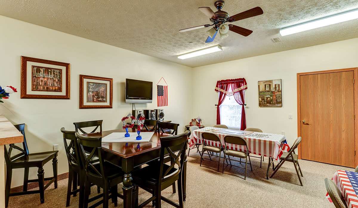 Community gathering space with dining tables at Beaumont Greene Senior Living in Athens, Ohio