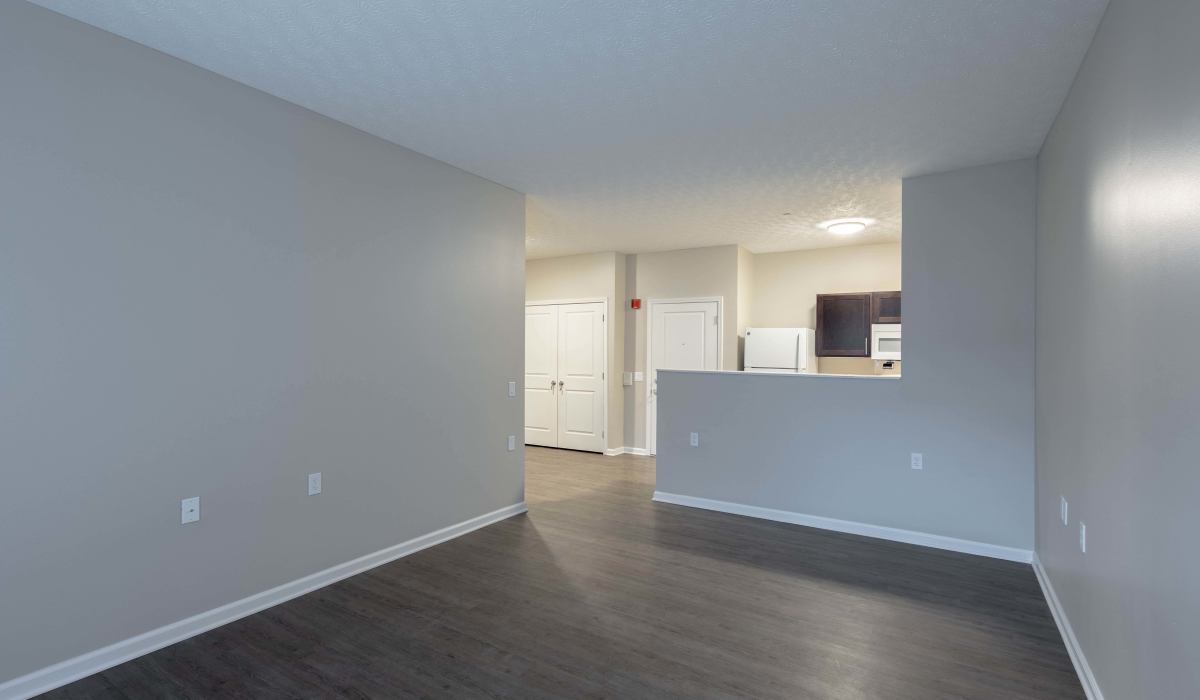 Open layout with wood-style flooring at Beaumont Greene Senior Living in Athens, Ohio