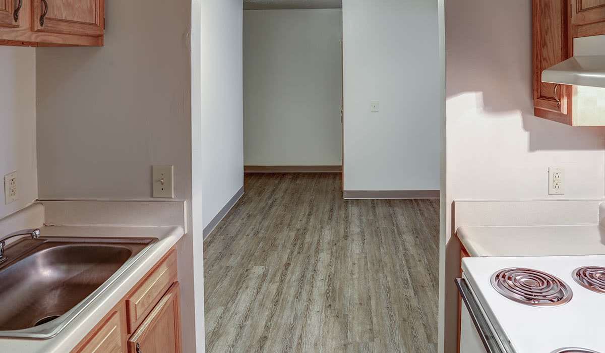 Open layout with wood-style flooring at Riverview Place in Ripley, Ohio
