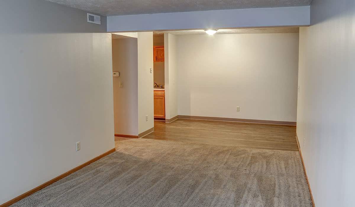 Spacious living area with wood-style flooring at Riverview Place in Ripley, Ohio