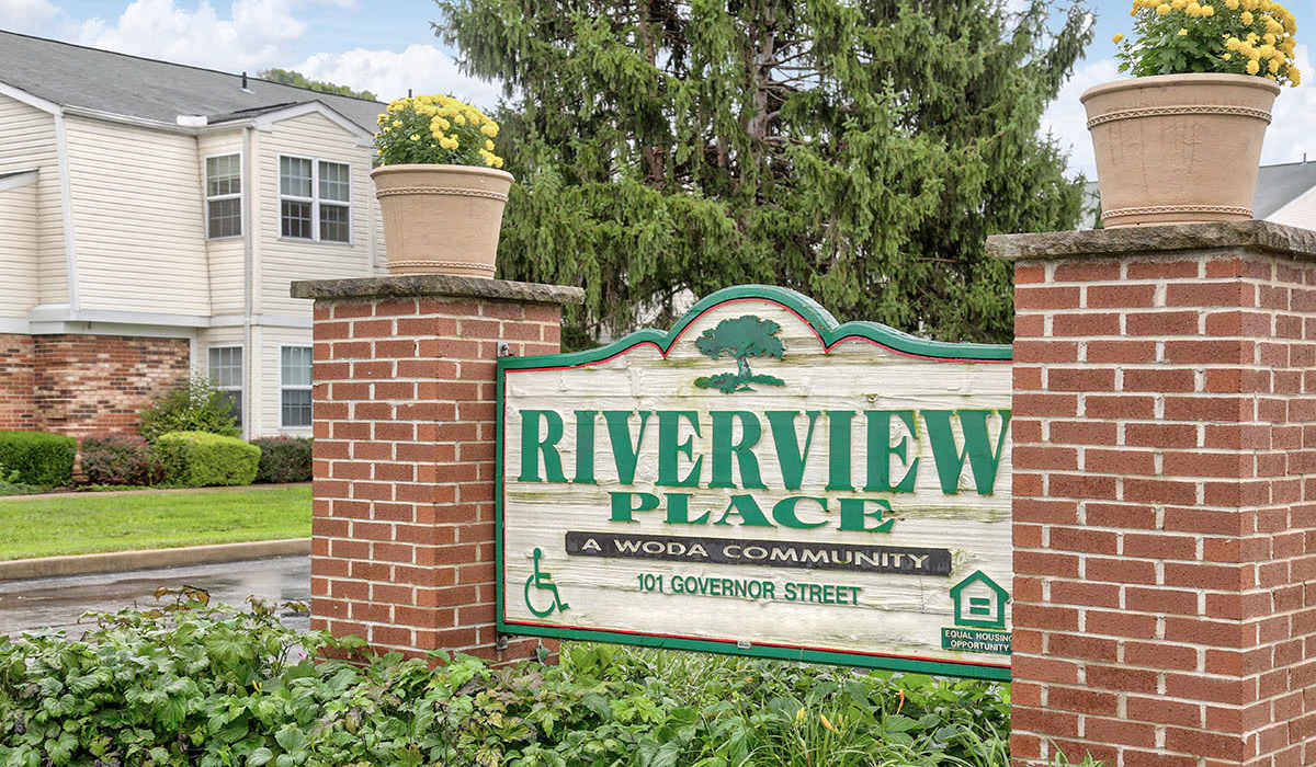 Community sign at entrance with landscaping at Riverview Place in Ripley, Ohio