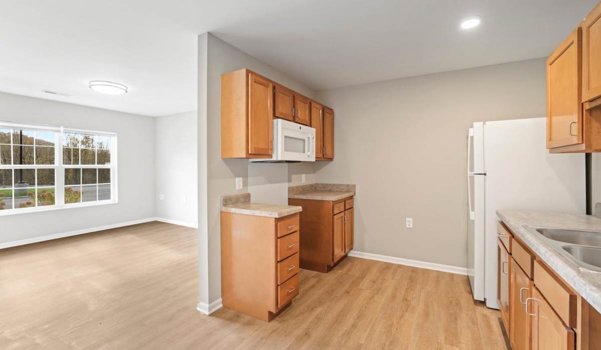 Kitchen with wooden cabinets at Kershaw Greene IV in Athens, Ohio 