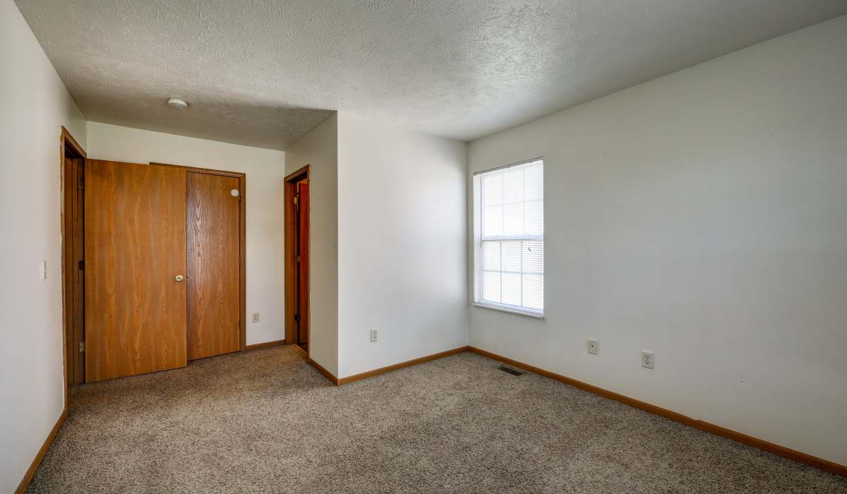Well-lit bedroom at Briarwood Place in Wintersville, Ohio 