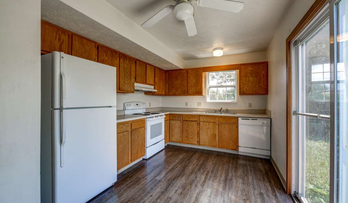 Kitchen with wooden cabinets at Briarwood Place in Wintersville, Ohio 