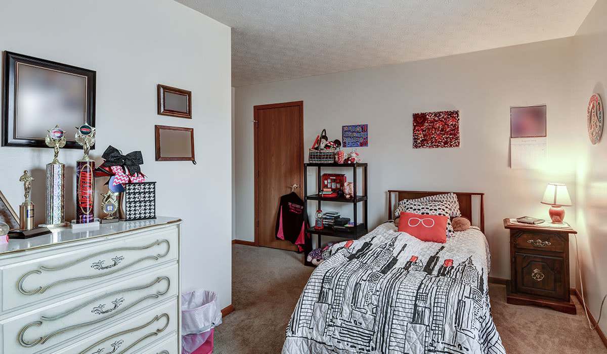 Cozy bedroom with personal decor at Chartwell Greene in Mount Gilead, Ohio