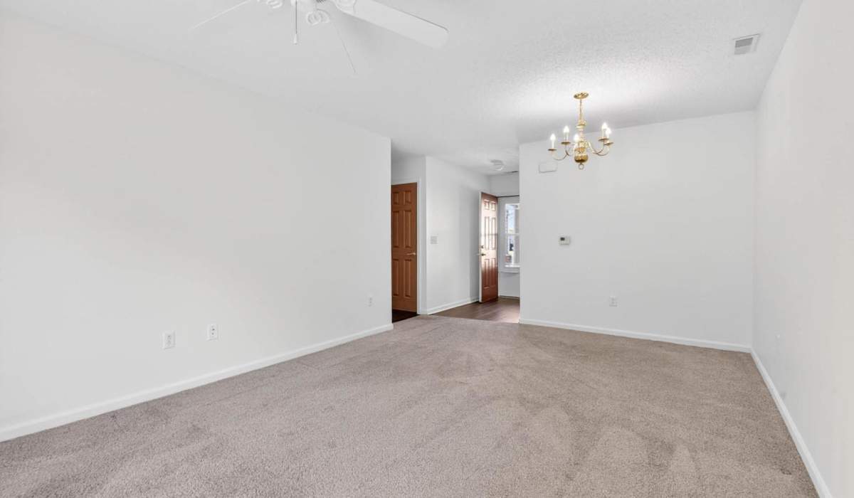Spacious living area with carpeted flooring at Lake Towne Senior in Walbridge, Ohio