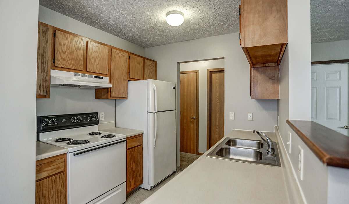 Granite countertops and wood-style cabinetry at Leewood Place in Fremont, Ohio