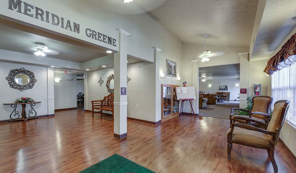 Welcoming lobby with wood-style flooring at Meridian Greene I in Wintersville, Ohio