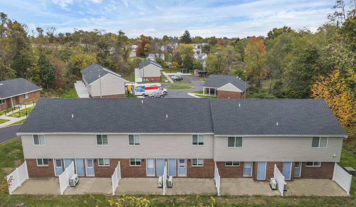 Brick and siding townhomes with patios at Plumly Townhomes in Barnesville, Ohio