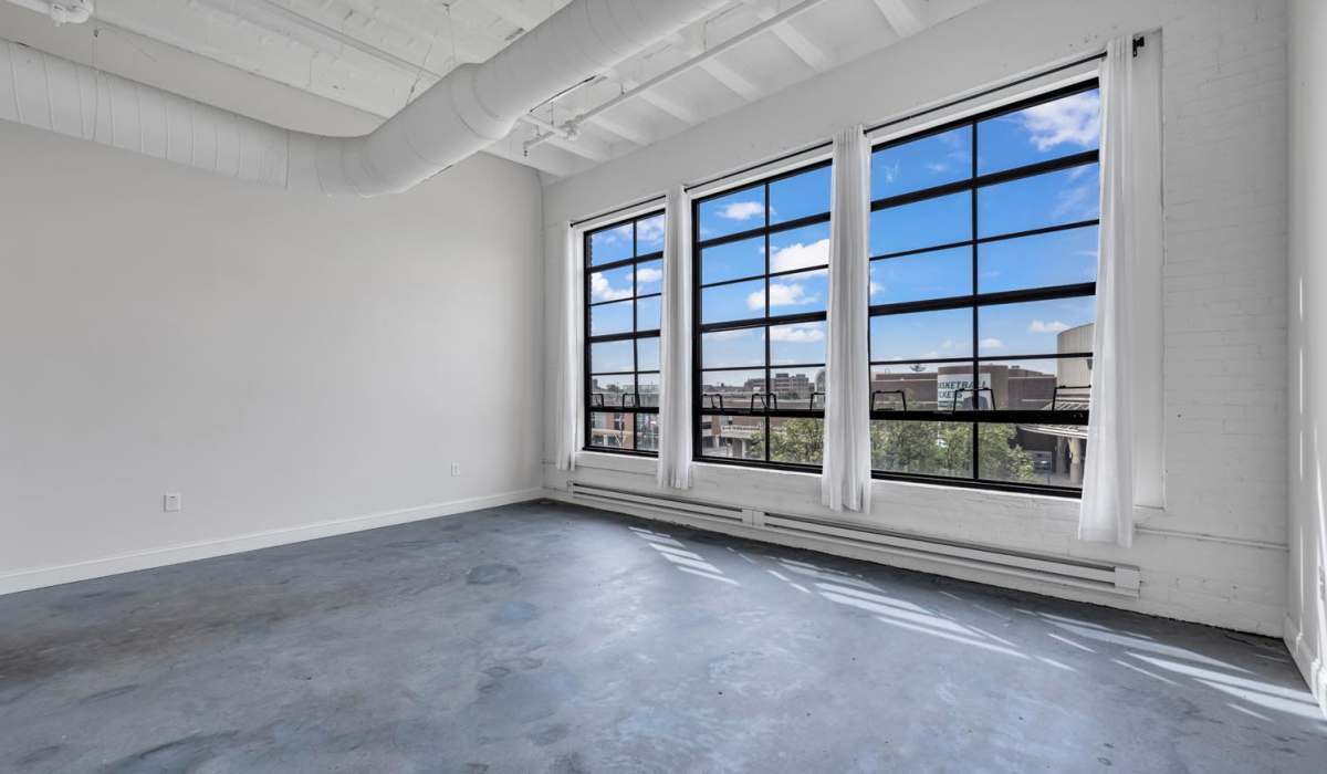 Living room with a large window at Prospect Yard in Cleveland, Ohio 