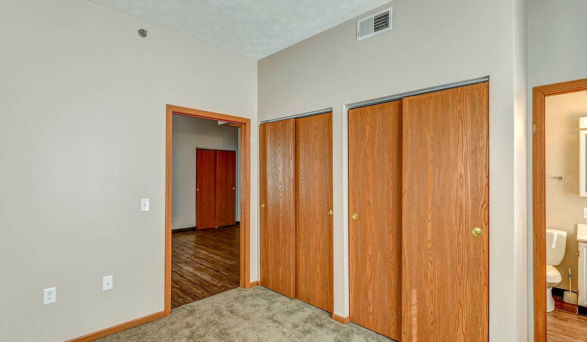 Wood-style flooring in spacious bedroom at St. Clairsville Courtyard in St. Clairsville, Ohio