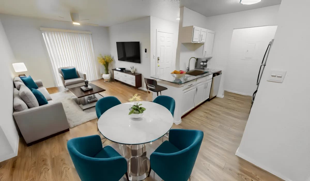 Open living with wood-style flooring at Patten East in Austin, Texas